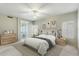 Serene bedroom features neutral decor, a plush bed, and an en-suite bathroom with modern fixtures at 9102 E Pershing Ave, Scottsdale, AZ 85260