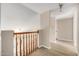 Bright hallway with wooden railings and updated floors in a well-maintained home at 961 E Lamplighter Ln, Tempe, AZ 85283