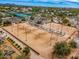 Aerial view showcasing multiple sand volleyball courts with covered seating and other community amenities at 10115 E Mountain View Rd # 2112, Scottsdale, AZ 85258