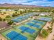 Aerial view of the tennis courts, recreation fields, and mountains at 10115 E Mountain View Rd # 2112, Scottsdale, AZ 85258