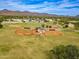 Aerial view of sports fields with multiple baseball diamonds and mountain views in distance at 10115 E Mountain View Rd # 2112, Scottsdale, AZ 85258