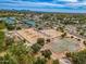 Aerial view showcasing multiple tennis courts, basketball courts, and sand volleyball courts at 10115 E Mountain View Rd # 2112, Scottsdale, AZ 85258