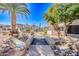 Community with desert landscaping, bridged stream, and palm trees at 10115 E Mountain View Rd # 2112, Scottsdale, AZ 85258