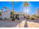 Charming building with palm trees, desert landscaping, and tiled roof at 10115 E Mountain View Rd # 2112, Scottsdale, AZ 85258