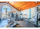 Bright gym with vaulted wood ceiling and fitness equipment by large windows at 10115 E Mountain View Rd # 2112, Scottsdale, AZ 85258