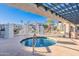 Inviting community spa surrounded by iron fencing and residential buildings with seating areas offering relaxation and social opportunities at 10115 E Mountain View Rd # 2112, Scottsdale, AZ 85258