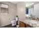 Bathroom featuring a granite countertop, wood vanity, and a toilet with a window at 1042 S Cheshire Ln, Gilbert, AZ 85296