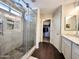 Modern bathroom with glass-enclosed shower, tiled walls, and updated vanity at 1042 S Cheshire Ln, Gilbert, AZ 85296