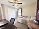 Comfortable bedroom with ceiling fan, closet, and neutral carpet at 1042 S Cheshire Ln, Gilbert, AZ 85296