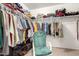 Walk in closet with racks and shelves provides ample storage space at 1042 S Cheshire Ln, Gilbert, AZ 85296