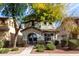 Charming two-story home with desert landscaping, arched porch, and stone accents at 1042 S Cheshire Ln, Gilbert, AZ 85296