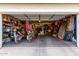 Open garage featuring storage shelves and two motorcycles at 1042 S Cheshire Ln, Gilbert, AZ 85296