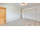 Bedroom with neutral carpet and ensuite bathroom at 10891 W Clair Dr, Sun City, AZ 85351