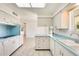 Spacious kitchen featuring white cabinets and blue countertops at 10891 W Clair Dr, Sun City, AZ 85351