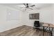 Bedroom area featuring wood floors, ceiling fan, and plenty of natural light at 1114 S Grenoble --, Mesa, AZ 85208