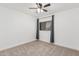 Bedroom with neutral carpet, window with curtains and a ceiling fan at 1114 S Grenoble --, Mesa, AZ 85208