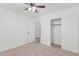 Bedroom featuring neutral carpet, a ceiling fan, and a closet at 1114 S Grenoble --, Mesa, AZ 85208