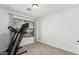 Bright room with a treadmill in front of a window with neutral carpet at 1114 S Grenoble --, Mesa, AZ 85208