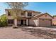 Charming two-story home with a well-manicured front yard and a two-car garage at 1114 S Grenoble --, Mesa, AZ 85208