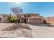 Home with a two-car garage, desert landscaping, and views of the roof and surrounding homes at 1114 S Grenoble --, Mesa, AZ 85208