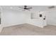 Loft area featuring neutral carpet, a ceiling fan, and white walls at 1114 S Grenoble --, Mesa, AZ 85208