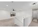 Loft area featuring neutral carpet, a window, a ceiling fan, and a staircase at 1114 S Grenoble --, Mesa, AZ 85208