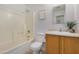 Bathroom featuring a shower and tub combination, modern lighting, and neutral decor at 11354 W Carousel Dr, Arizona City, AZ 85123