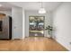 Bright dining area with sliding glass doors and hardwood floors at 11354 W Carousel Dr, Arizona City, AZ 85123