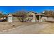 Traditional single-story house with a two car garage, drought tolerant front yard, and stone paver path at 11354 W Carousel Dr, Arizona City, AZ 85123