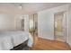 Spacious main bedroom with mirrored closet doors and attached bathroom featuring a shower at 11354 W Carousel Dr, Arizona City, AZ 85123