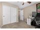 Neutral bedroom features a closet and a ceiling fan at 11457 W Madisen Ellise Dr, Surprise, AZ 85378