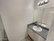 Neat bathroom with a white vanity, sink, mirror, and good lighting at 11595 W Holly St, Avondale, AZ 85392