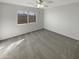 Bedroom with carpet, ceiling fan, and a sunny window view at 11595 W Holly St, Avondale, AZ 85392