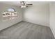 Cozy bedroom with natural light, neutral carpet, and street view at 11595 W Holly St, Avondale, AZ 85392