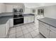 Modern kitchen with stainless steel appliances and tile flooring at 11595 W Holly St, Avondale, AZ 85392