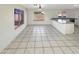 Bright kitchen and dining area with tile flooring, ample counter space, and natural lighting at 11595 W Holly St, Avondale, AZ 85392