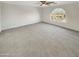 Spacious main bedroom featuring neutral carpet, paint, and trim at 11595 W Holly St, Avondale, AZ 85392