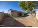 Spacious backyard features lush grass and mature tree, perfect for outdoor entertaining and relaxation at 11910 W Daley Ct, Sun City, AZ 85373