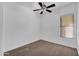 Bedroom with neutral carpet, ceiling fan and one window for natural light at 11910 W Daley Ct, Sun City, AZ 85373