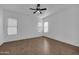 Bright living room with tile floors, ceiling fan, and large windows with plenty of natural light at 11910 W Daley Ct, Sun City, AZ 85373