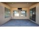 Covered patio with TV, providing an outdoor space for entertainment and relaxation at 11910 W Daley Ct, Sun City, AZ 85373