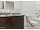 Bathroom featuring dark wood vanity with granite countertop and shower-tub combo at 11928 E Aster Ln, Florence, AZ 85132