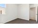 Bedroom with carpet, baseboards, and bright light through the window at 11928 E Aster Ln, Florence, AZ 85132