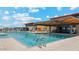 Stunning community pool with seating and shaded structure, perfect for relaxing and socializing at 11928 E Aster Ln, Florence, AZ 85132