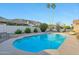 A private backyard with a sparkling pool, desert landscaping, mature plants, and mountain views at 1201 W Dahlia Dr, Phoenix, AZ 85029