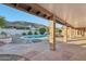 Backyard featuring a refreshing pool, mountain view, desert landscaping, and brick-covered patio at 1201 W Dahlia Dr, Phoenix, AZ 85029