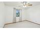 Bedroom featuring neutral carpet, ceiling fan, and window with exterior view at 1201 W Dahlia Dr, Phoenix, AZ 85029