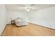 Spacious bedroom featuring wood floors, ceiling fan, and bright, neutral colored walls at 1201 W Dahlia Dr, Phoenix, AZ 85029