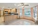 Inviting kitchen area with a breakfast bar, granite countertops, and views of the backyard pool at 1201 W Dahlia Dr, Phoenix, AZ 85029