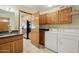 Mud room with laundry, sink, dark counters, and stainless refrigerator with access to the kitchen at 1201 W Dahlia Dr, Phoenix, AZ 85029